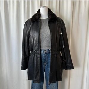 Vintage Couture women’s black leather jacket with faux fur collar.